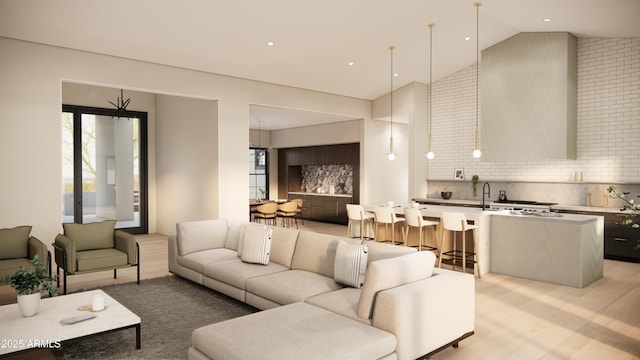 living room with sink, light hardwood / wood-style floors, and high vaulted ceiling