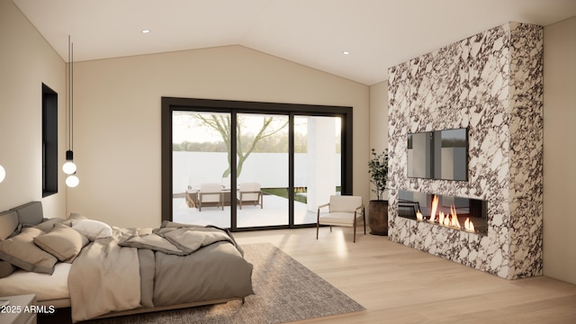 bedroom with lofted ceiling, light hardwood / wood-style floors, and access to outside