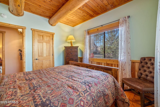 bedroom with beamed ceiling and wooden ceiling