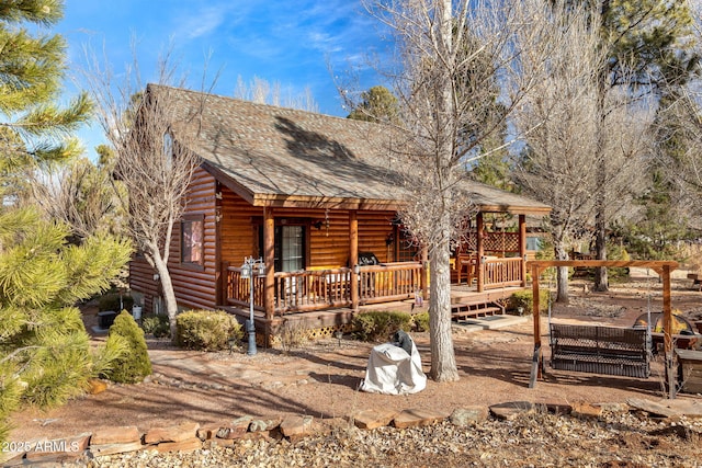 view of log cabin