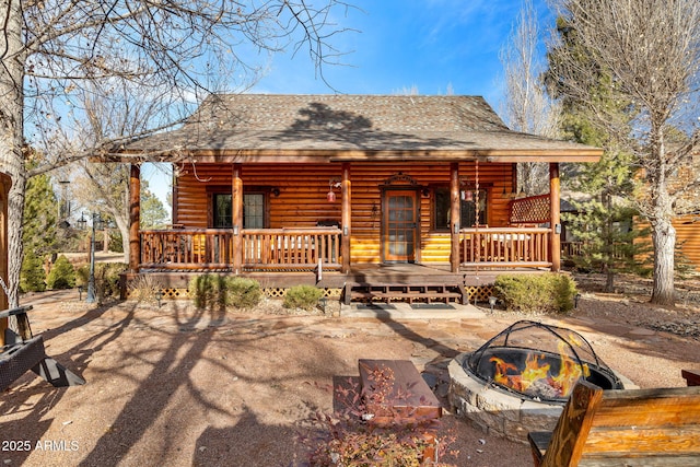 cabin featuring covered porch