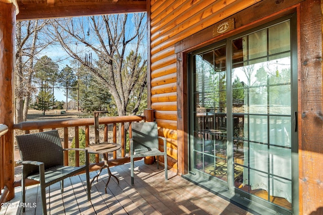 wooden terrace featuring covered porch