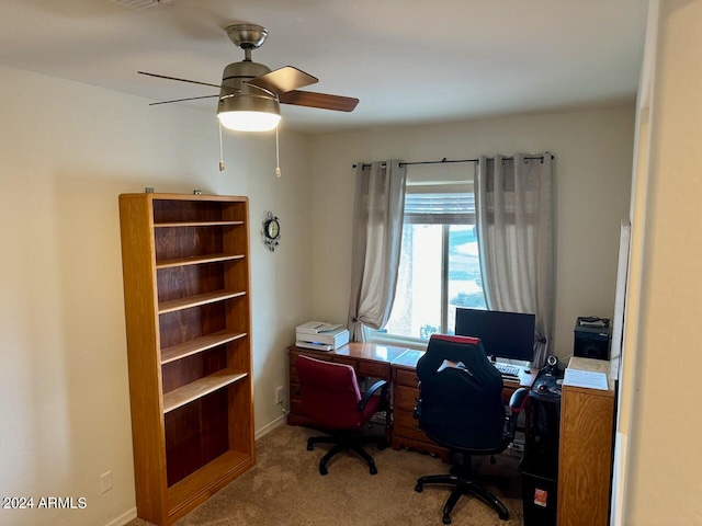 carpeted office with ceiling fan