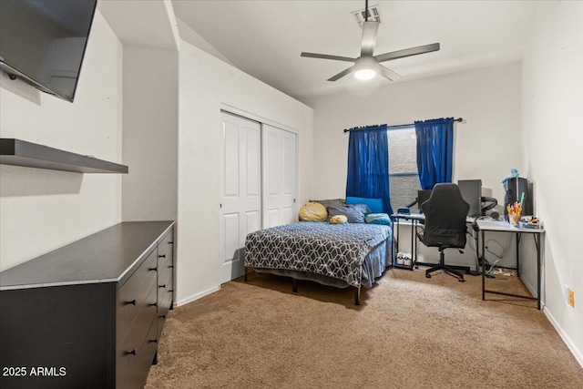 bedroom with a closet, carpet flooring, ceiling fan, and visible vents