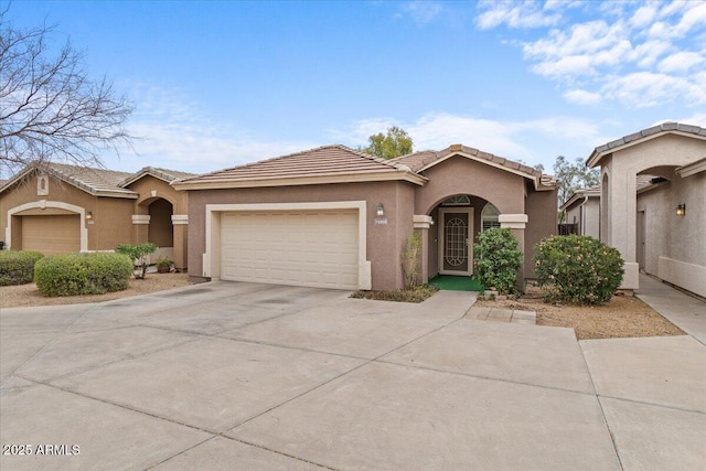 15203 N 28th Pl, Phoenix, AZ 85032 - view of front of house with an attached garage, a tiled roof, stucco siding, and driveway