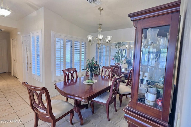 dining room with light tile patterned floors, vaulted ceiling, visible vents, and a notable chandelier