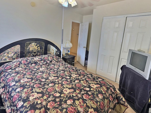 bedroom with a closet and light colored carpet