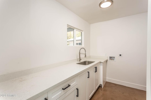 laundry area with cabinets, hookup for a washing machine, sink, and electric dryer hookup