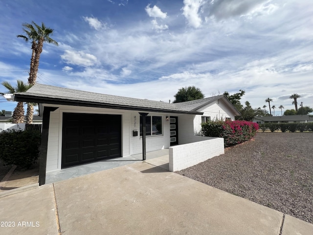 view of front of property featuring a garage