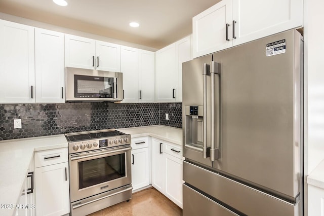 kitchen featuring white cabinetry, backsplash, and appliances with stainless steel finishes