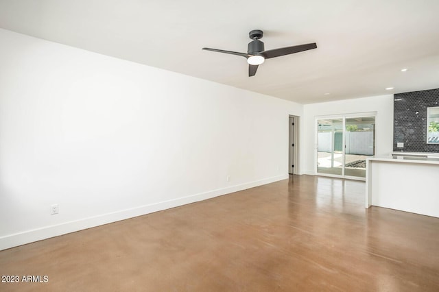 unfurnished living room with concrete flooring and ceiling fan