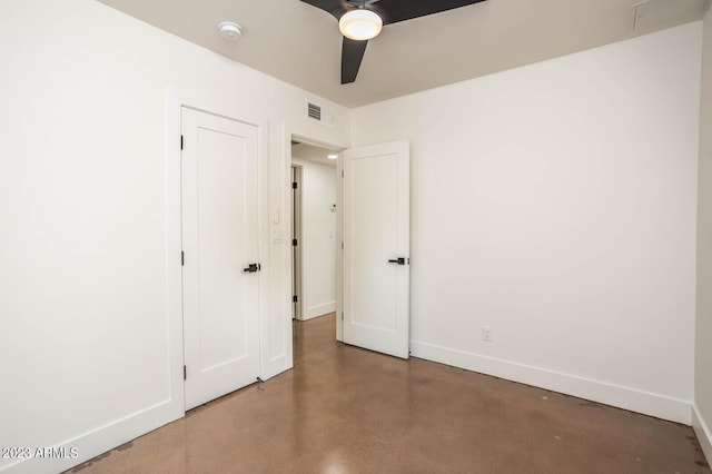 unfurnished bedroom with concrete floors and ceiling fan
