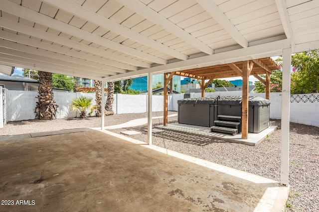 view of patio / terrace with a hot tub