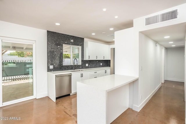 kitchen with sink, white cabinetry, dishwasher, kitchen peninsula, and backsplash