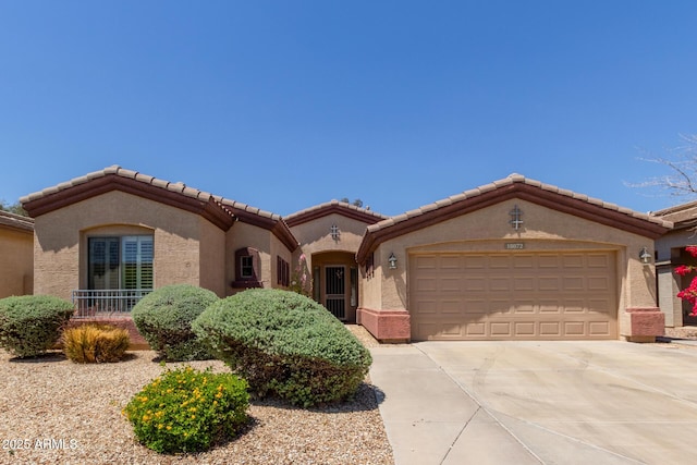 18072 W Paradise Ln, Surprise, AZ 85388 - mediterranean / spanish home with a tiled roof, a garage, driveway, and stucco siding