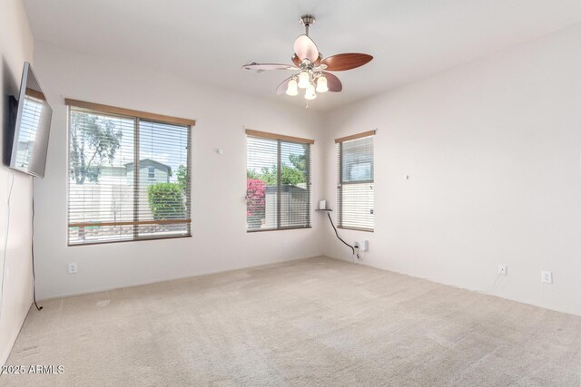 18072 W Paradise Ln, Surprise, AZ 85388 - spare room featuring carpet floors and ceiling fan