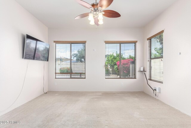 18072 W Paradise Ln, Surprise, AZ 85388 - spare room with a ceiling fan, a healthy amount of sunlight, and carpet
