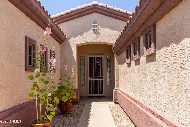 18072 W Paradise Ln, Surprise, AZ 85388 - property entrance with a tile roof and stucco siding