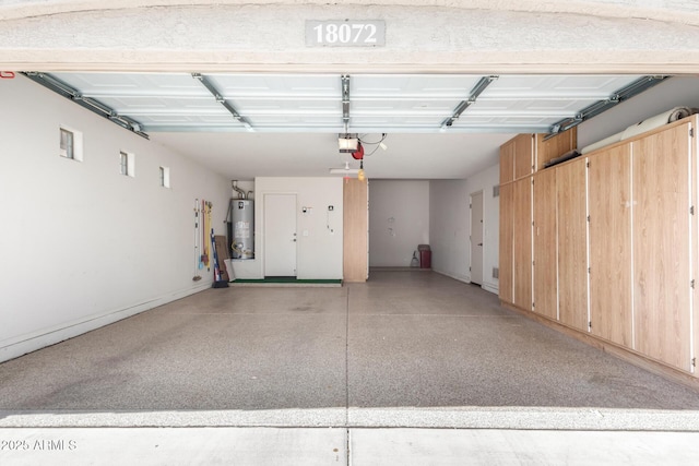 18072 W Paradise Ln, Surprise, AZ 85388 - garage with baseboards and gas water heater