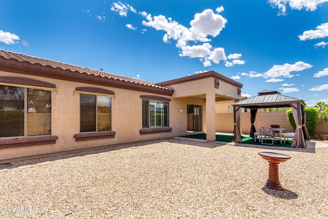 18072 W Paradise Ln, Surprise, AZ 85388 - back of house featuring a patio, a gazebo, fence, and stucco siding