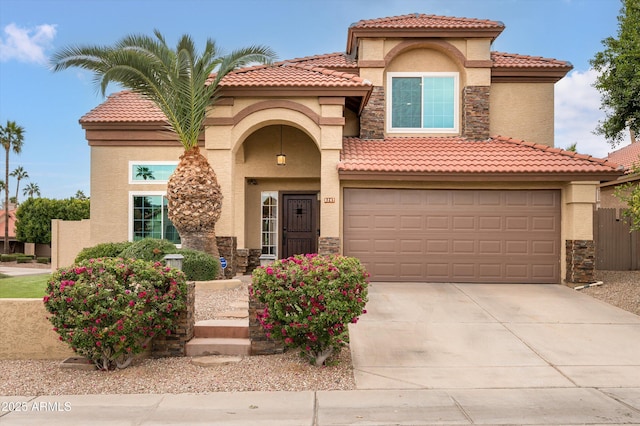 mediterranean / spanish-style home featuring a garage