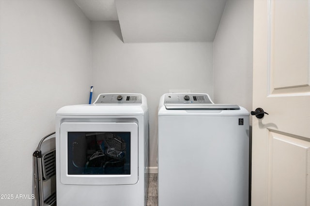 clothes washing area with independent washer and dryer