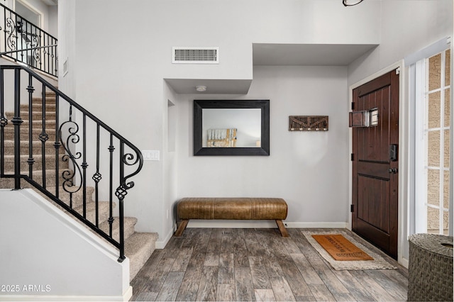 foyer entrance featuring wood-type flooring