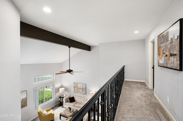 hall with vaulted ceiling with beams and carpet