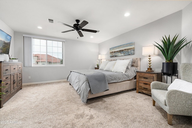 bedroom with ceiling fan and light colored carpet