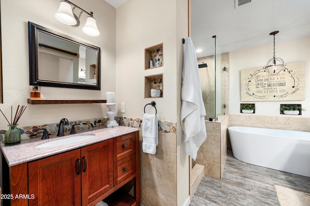 bathroom with separate shower and tub, vanity, wood-type flooring, and tile walls