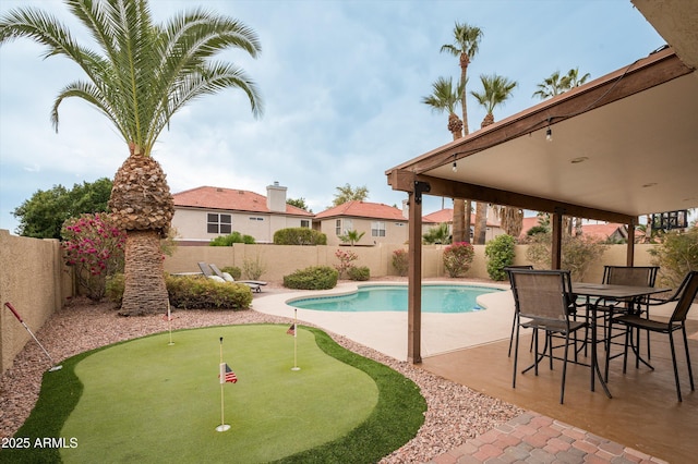 view of swimming pool with a patio area