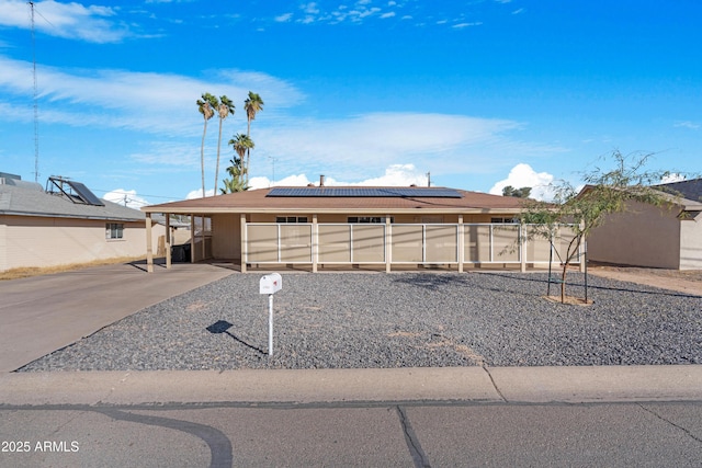 view of front of home featuring solar panels