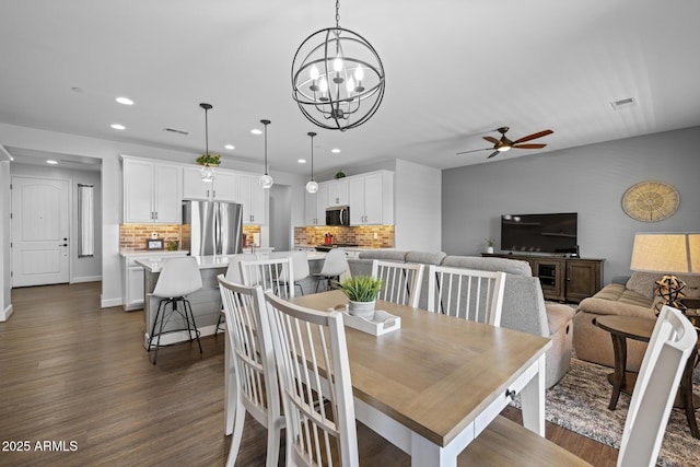 14573 W Reade Ave, Litchfield Park, AZ 85340 - dining room featuring ceiling fan, recessed lighting, dark wood finished floors, and a chandelier