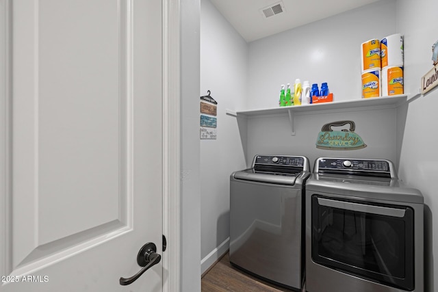 14573 W Reade Ave, Litchfield Park, AZ 85340 - laundry room with washing machine and dryer and wood finished floors