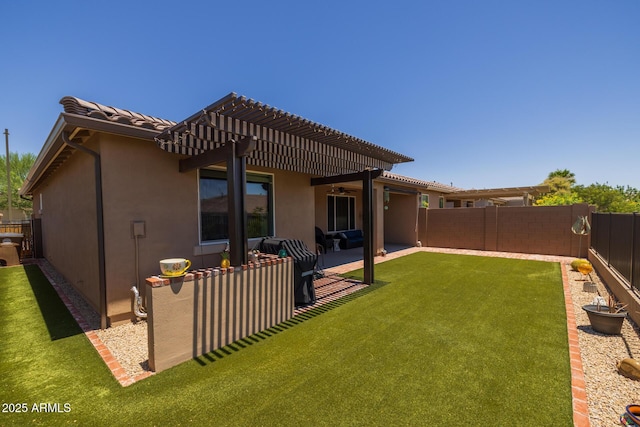 14573 W Reade Ave, Litchfield Park, AZ 85340 - rear view of house with a fenced backyard, ceiling fan, a pergola, stucco siding, and a patio