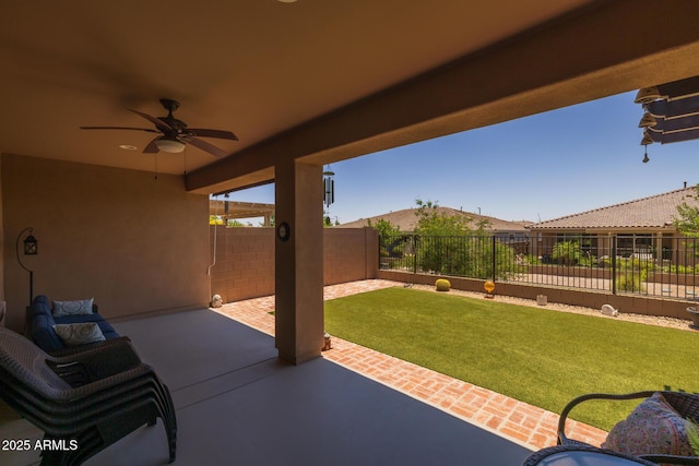 14573 W Reade Ave, Litchfield Park, AZ 85340 - fenced backyard with a ceiling fan and a patio