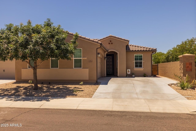 14573 W Reade Ave, Litchfield Park, AZ 85340 - mediterranean / spanish-style house with stucco siding and a tiled roof