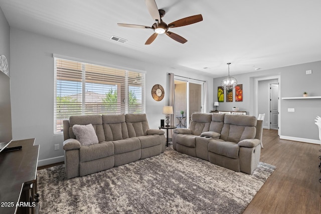 14573 W Reade Ave, Litchfield Park, AZ 85340 - living area with wood finished floors, a chandelier, and ceiling fan