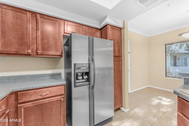 kitchen featuring stainless steel fridge with ice dispenser, crown molding, and light tile patterned floors