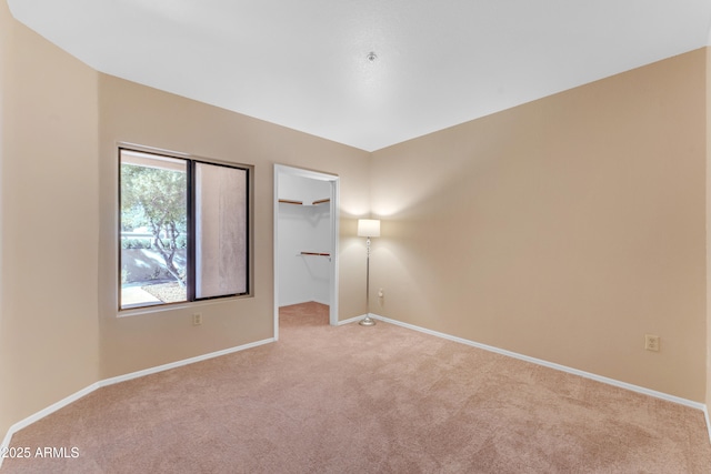 spare room with light colored carpet