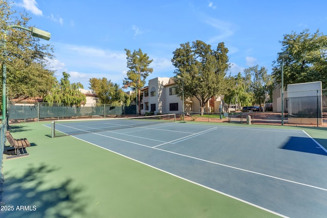 view of sport court featuring basketball hoop