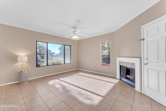 unfurnished living room featuring ceiling fan and light tile patterned floors