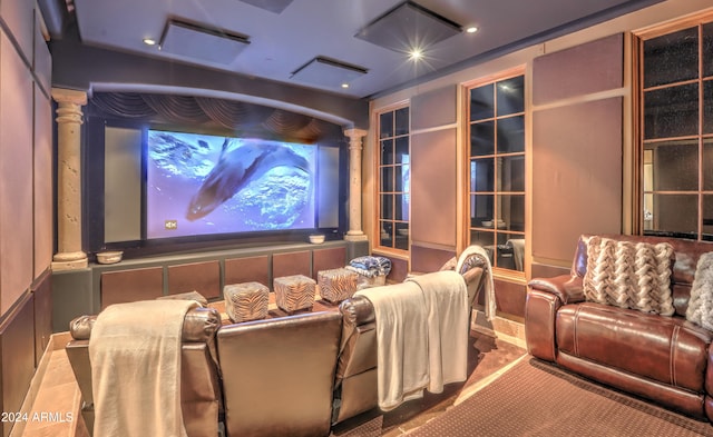 home theater featuring ornate columns and carpet floors