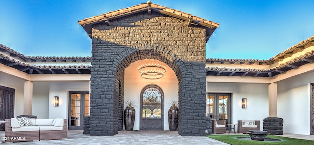 exterior space with an outdoor hangout area and a patio area