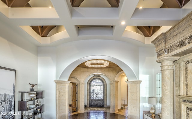 foyer entrance with hardwood / wood-style flooring, beam ceiling, coffered ceiling, and decorative columns