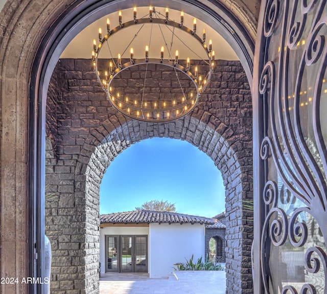 exterior details featuring an inviting chandelier