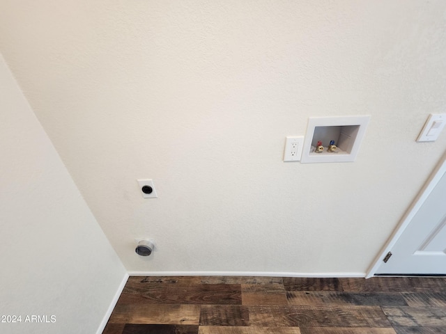 washroom with hookup for an electric dryer, dark hardwood / wood-style flooring, and hookup for a washing machine