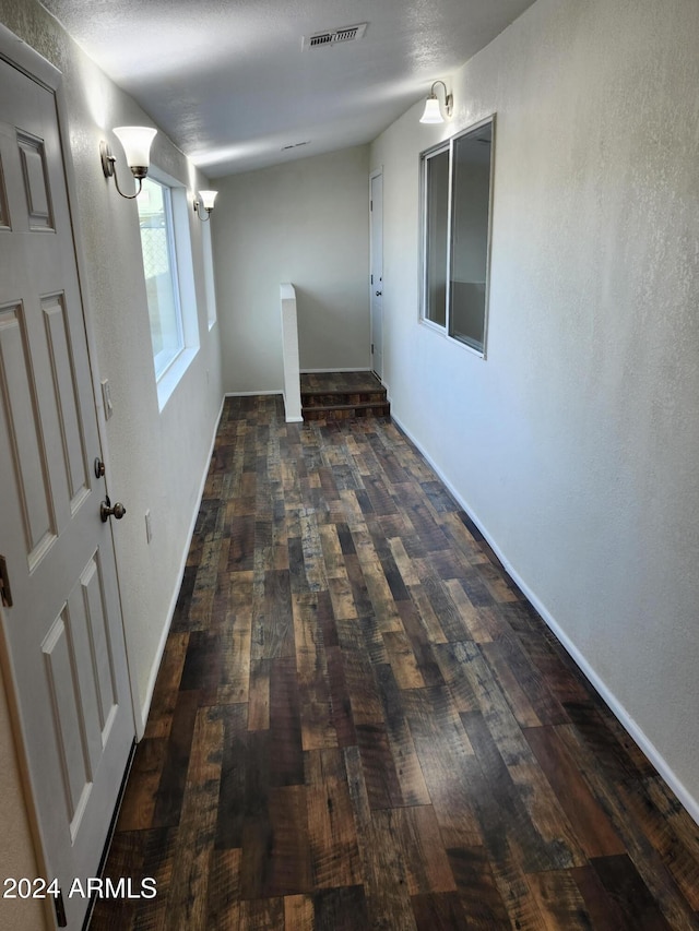 hallway featuring dark hardwood / wood-style flooring