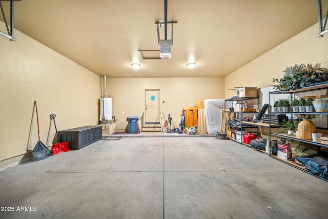 garage with gas water heater and a garage door opener