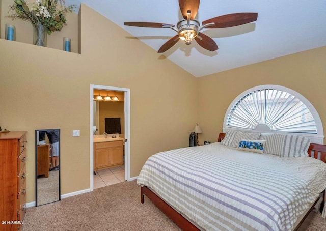 5640 E Bell Rd Unit 1099, Scottsdale, AZ 85254 - bedroom with light carpet, lofted ceiling, ensuite bathroom, and ceiling fan